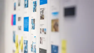 Several information and image boards hanging on a wall, shown with a blurred foreground focus.